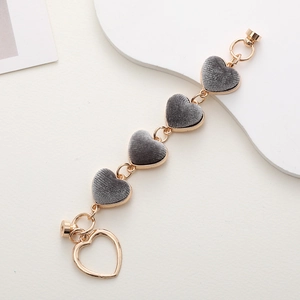 Zinc alloy plush heart bracelet with grey velvet inlay and golden metal frame details