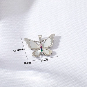 Macro view of butterfly pendant showing shell wings, colorful zircon, and 17.92mm size