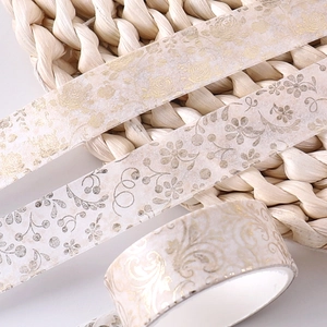 Floral washi tape with gold foil rose patterns on beige background for DIY scrapbooking