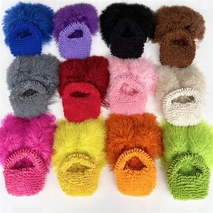 Flat lay of colorful plush woven handbags in twelve different candy colors for selection