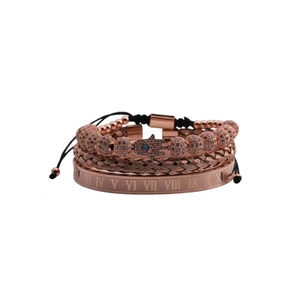 Three-piece rose gold bracelet set with Roman numerals, woven cord and Evil Eye charm