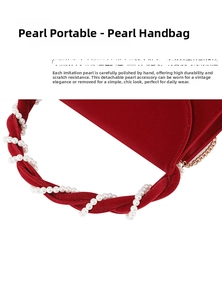 Close-up of red velvet handbag featuring a detachable pearl-wrapped handle and gold chain