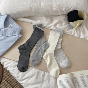 Breathable mid-calf cotton socks for women with delicate lace trim in neutral tones
