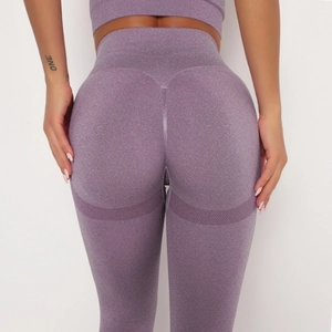 Macro detail of purple seamless high waist yoga pants showing compression and contouring texture
