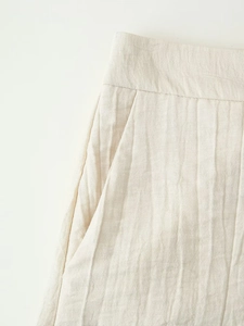 Detail view of cotton linen vest shorts set showing side pocket and waist texture