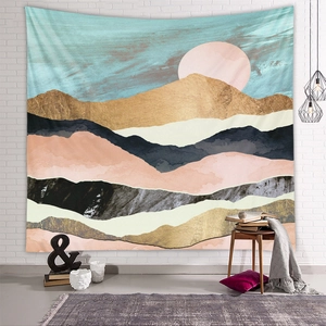Detail of Nordic tapestry with abstract mountain and sun design on a white brick wall