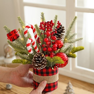 Artificial Christmas pine tree with pinecones berries and warm LED lights in plaid base