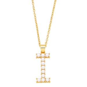Detailed view of golden letter I pendant with white faux pearls on a white background