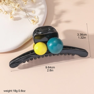 Detailed size chart of a large black hair claw clip with colorful ball ornaments