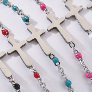 Silver stainless steel cross bracelet with colorful enamel beads in multiple vibrant colors
