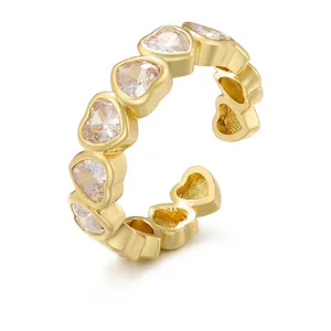 Adjustable gold heart ring with pavé cubic zirconia inlay in minimalist brass style