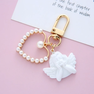 Vintage baroque angel keychain with golden heart pearl frame and resin cupid pendant