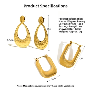 Macro shot of gold hollow crescent earrings showing hammered texture and U-shape design