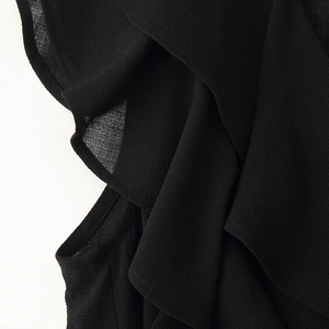 Women's black boho set featuring layered ruffle trim and sheer chiffon textured fabric