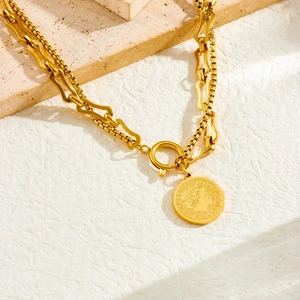 Vintage gold layered necklace with Elizabeth II coin pendant and T-bar clasp closure