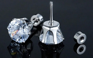Macro detail of silver screw-back earrings with six-prong set cubic zirconia