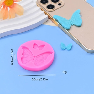 Macro detail of pink silicone butterfly mold with dimensions 5.5cm and 0.9cm shown