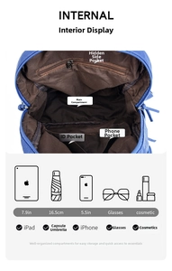 Internal structure of blue backpack showing zippered pocket and functional open compartments