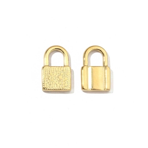 Detail of golden stainless steel heart locks with hammered and polished finishes for DIY