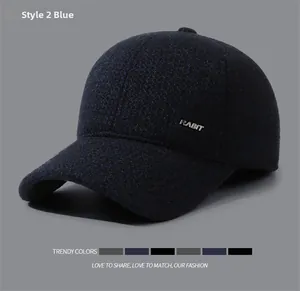 Close-up of blue tweed winter baseball cap with RABIT metal logo and thick fabric texture