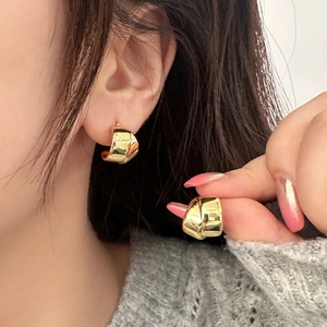 Fashionable gold knot hoop earrings for women with high-polish metallic finish