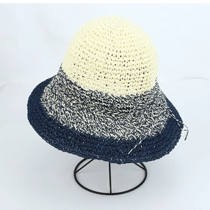 Women's crochet straw sun hat with wide brim in beige and navy blue color block style