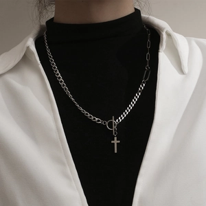 Silver stainless steel cross necklace with T-bar clasp shown on a model's neck