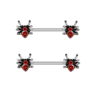 Detail of silver nipple rings with spider designs and red heart-shaped gemstones