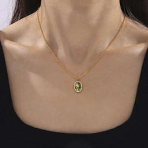 Elegant gold titanium necklace with oval iridescent shell pendant and star design