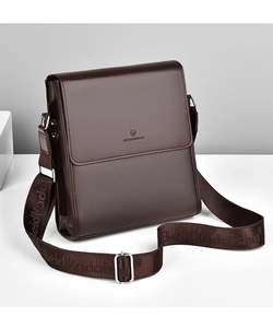 Detailed view of dark brown textured leather messenger bag with adjustable strap buckle