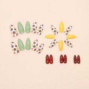 French floral press-on nails in olive green and warm yellow long stiletto shape