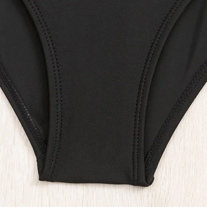 Detail of double-needle stitching on black high-elastic swimwear fabric edge