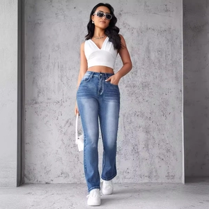 Women's high waist distressed blue patchwork jeans in a trendy street style look