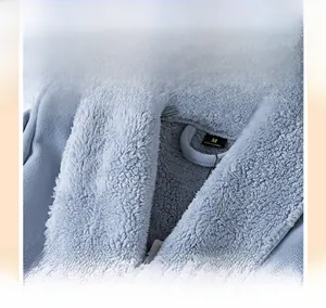 Detail view of the soft shawl collar on a light blue thick flannel plush bathrobe