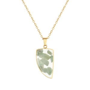Detail of gold chain necklace featuring a semi-circular pendant with natural green stones