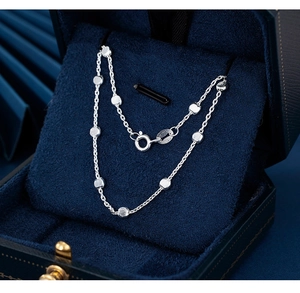 Detailed macro view of S925 sterling silver chain necklace inside a velvet jewelry box