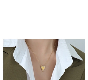 Detailed view of an 18k gold plated heart necklace styled with professional office attire