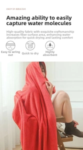 Close-up of red absorbent coral fleece bath towel with ribbed texture and soft microfiber