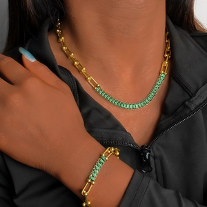 Golden horseshoe link necklace and bracelet set with green rectangular zircon stones