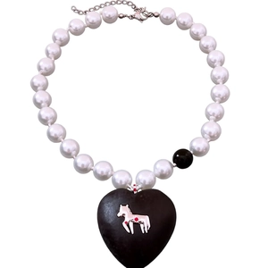 Vintage style pearl necklace with large black heart pendant and silver pony detail