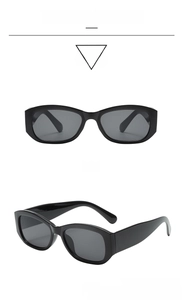 Front and side views of vintage rectangular black sunglasses with grey lenses