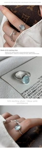 Close-up of S925 sterling silver ring featuring a translucent light blue oval stone inlay