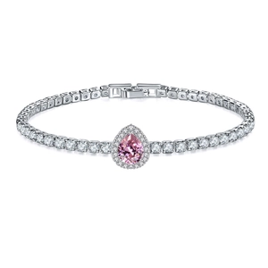Detail of tennis bracelet featuring a teardrop pink stone and pavé cubic zirconia