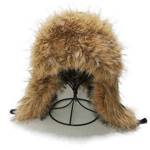 Detailed close-up of brown faux fox fur aviator hat with plush texture and ear flaps