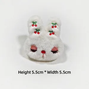 Close-up of white plush rabbit brooch with cherry embroidery, size H5.5cm x W5.5cm