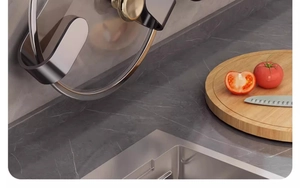 Detail of grey stainless steel lid rack mounted on marble wall in modern kitchen