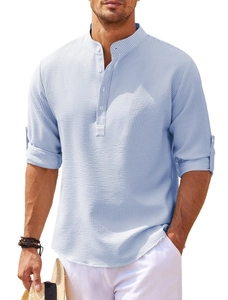 Macro shot of light blue striped waffle fabric texture on a long sleeve Henley shirt