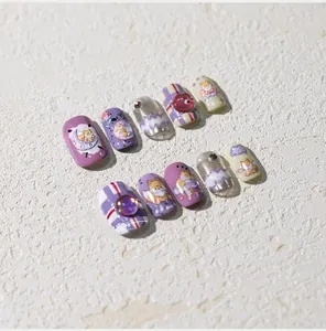 Detail of 3D Shiba Inu nail charms on lavender and purple glitter press-on nails
