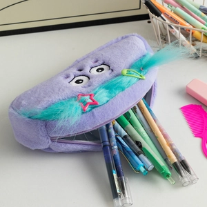 Detail of cute purple plush monster pencil case with fluffy hair and colorful star clips