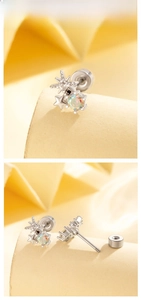 Detailed macro view of silver star earrings with iridescent opal and screw back closure